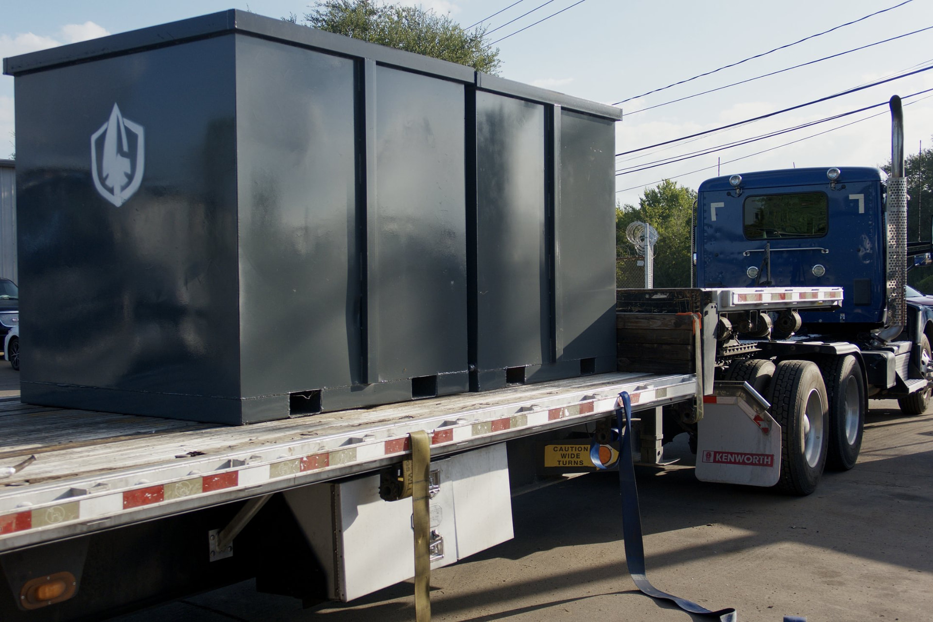 Spartan Metals steel bin loaded on a flatbed trailer
