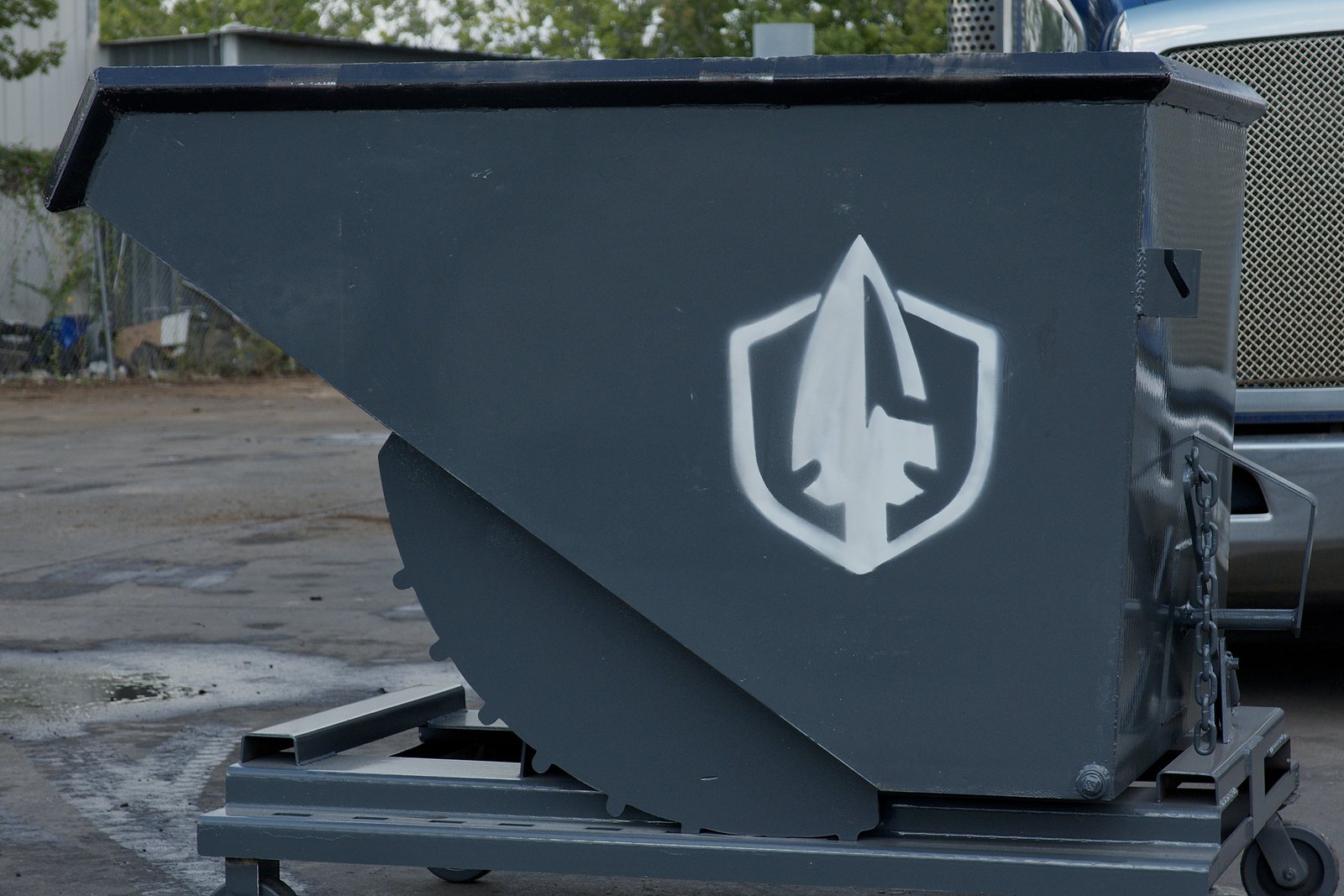 Spartan Metals self-dumping hopper with the shield logo